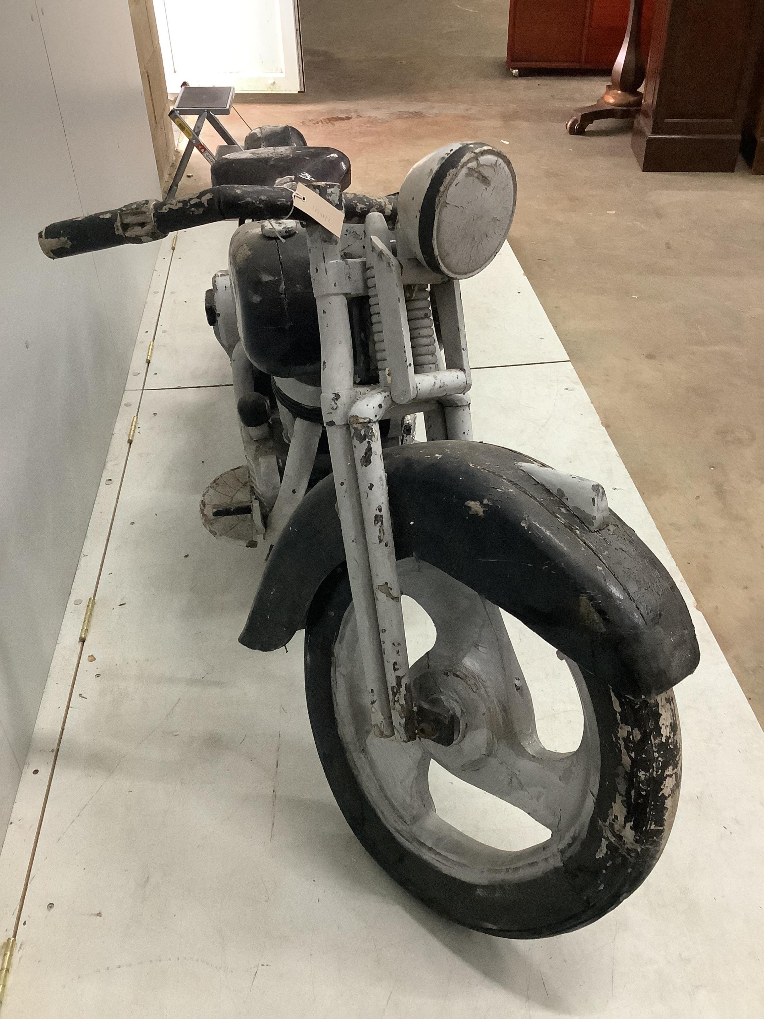 A wooden Harley Davidson, possibly an advertising piece, length 220cm. Condition - poor